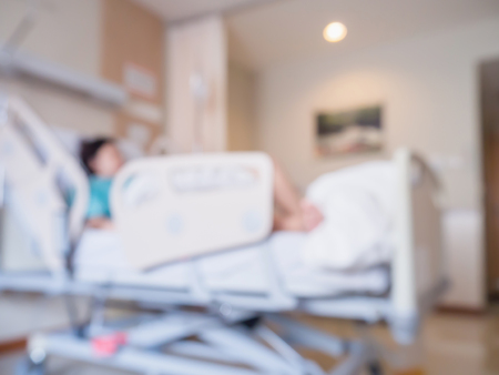 Abstract blur Patient on bed in Hospital Room interior for backgroundの写真素材