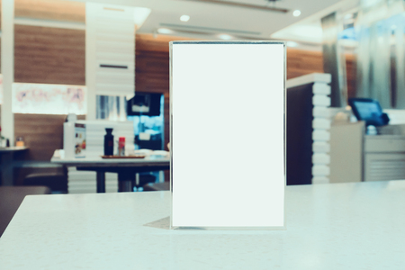 Mock up Blank Menu frame on Table in cafe restaurantの写真素材
