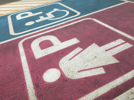 Lady and handicap sign in parking lotの写真素材