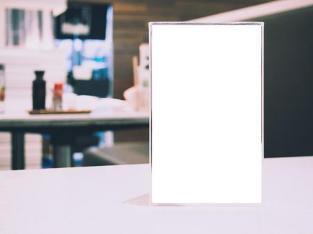 Mock up Blank Menu frame on Table in cafe restaurantの写真素材