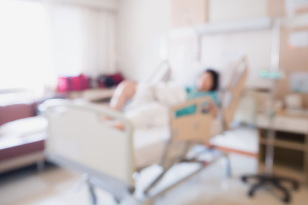 Abstract blur Patient on bed in Hospital Room interior for backgroundの写真素材