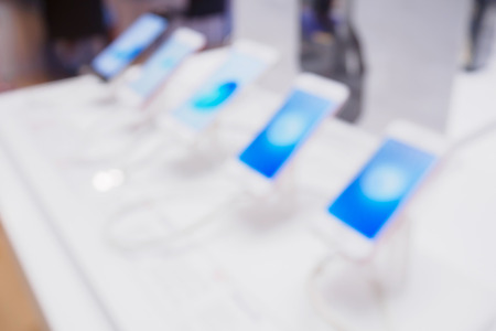abstract mobile smartphone in store blurred backgroundの写真素材