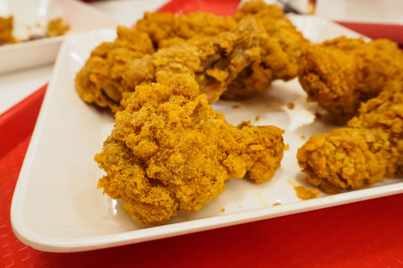 hot crispy fried chicken on white plateの写真素材