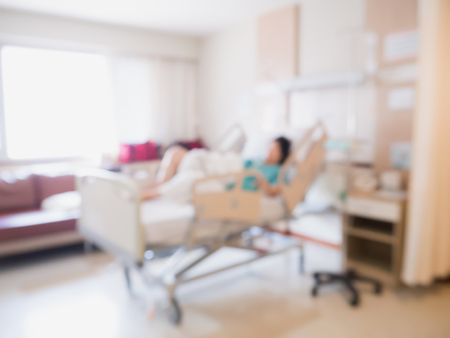 Abstract blur Patient on bed in Hospital Room interior for backgroundの写真素材