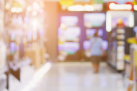 Television show in electronic department store with customer in shopping mall with bokeh light defocused blurred backgroundの写真素材