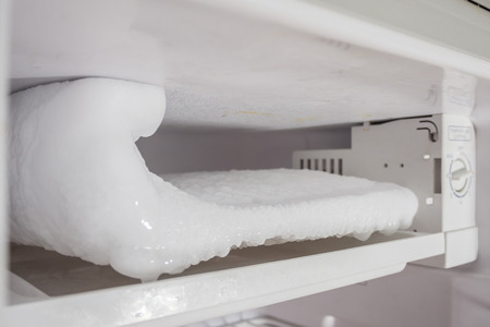 frozen Ice buildup in the freezer of refrigeratorの写真素材