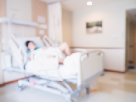 Abstract blur Patient on bed in Hospital Room interior for backgroundの写真素材