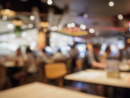 People in restaurant cafe or coffee shop interior with bokeh light blurred customer abstract business background, for create montage product display templateの写真素材