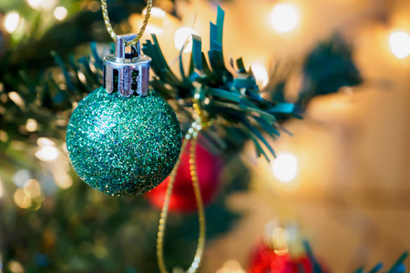 Christmas tree decorations on the branches backgroundの写真素材