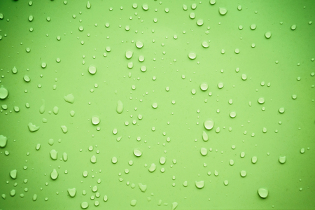 Water drops on green backgroundの写真素材