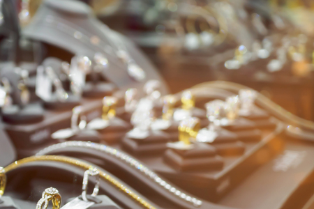 Abstract blur jewelry diamond shop with rings and necklaces luxury retail store showcase window display defocused backgroundの写真素材