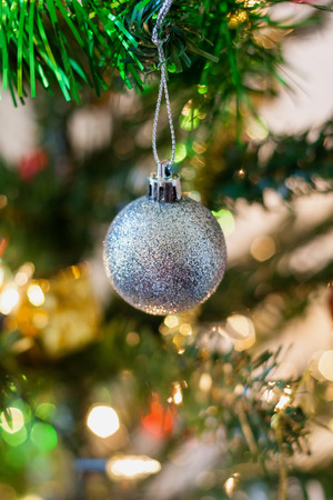 Christmas tree decorations on the branches backgroundの写真素材
