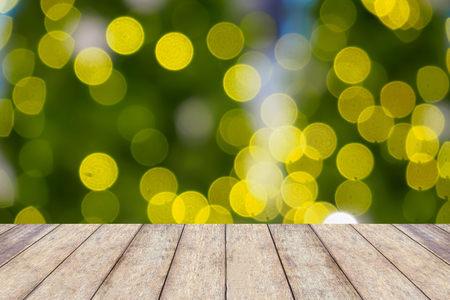 wood table with abstract christmas blurred backgroundの写真素材