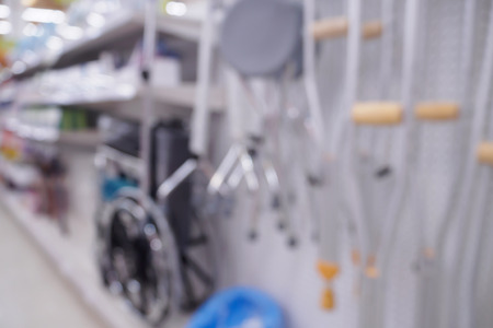 Pharmacy store shelves with wheelchair and walker defocused blur backgroundの写真素材