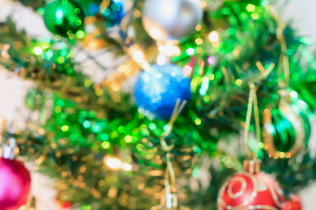Abstract Christmas tree with decorations bokeh light blur backgroundの写真素材