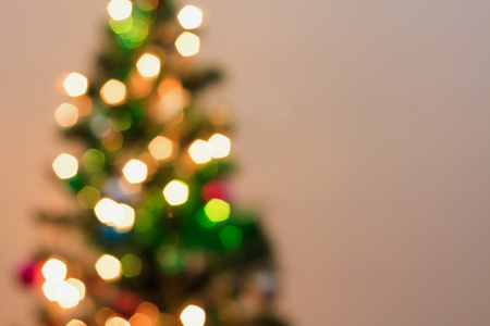 Abstract Christmas tree with decorations bokeh light blur backgroundの写真素材