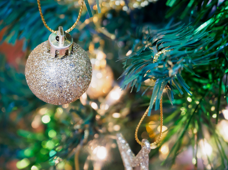 Christmas tree decorations on the branches backgroundの写真素材