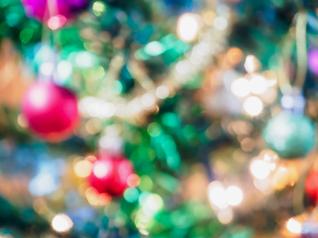 Abstract Christmas tree with decorations bokeh light blur backgroundの写真素材