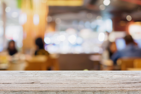 Blur customers in cafe restaurant or coffee shop abstract background with bokeh lightの写真素材