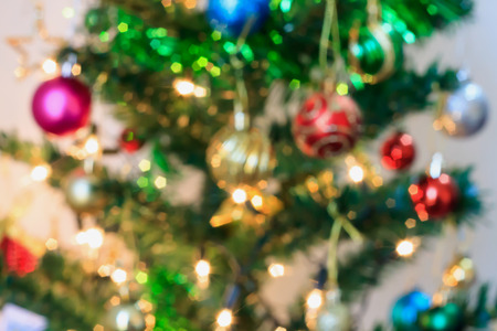 Abstract Christmas tree with decorations bokeh light blur backgroundの写真素材