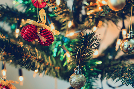 Christmas tree decorations on the branches backgroundの写真素材