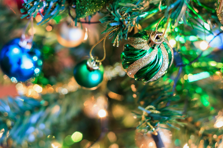 Christmas tree decorations on the branches backgroundの写真素材