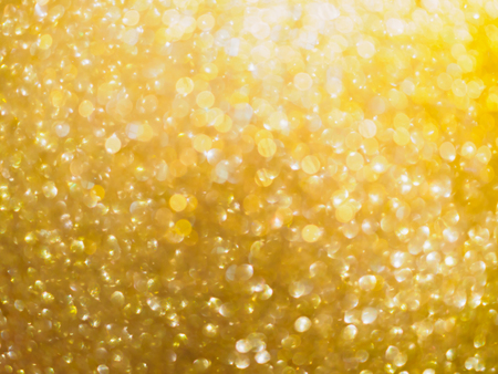 Christmas golden glow bokeh light blur abstract Backgroundの写真素材