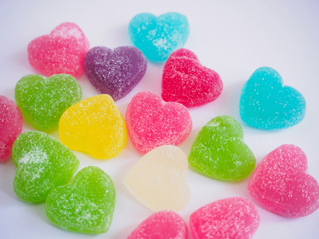 colorful hearts candy on white for valentines backgroundの写真素材