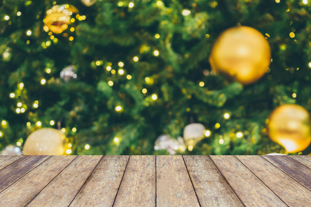 Abstract Christmas holiday bokeh light background with empty wood table for create montage productの写真素材