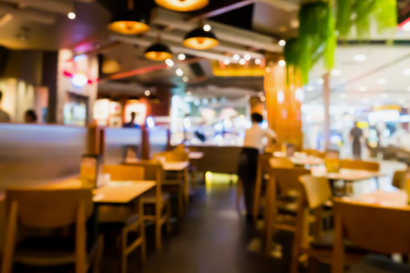 Restaurant cafe interior abstract blur background with bokeh lightの写真素材