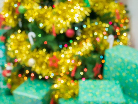 Christmas tree decorated with lights abstract blur background with bokehの写真素材