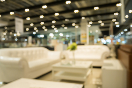Abstract blur sofa in furniture store shop interior with bokeh light background for montage product displayの写真素材