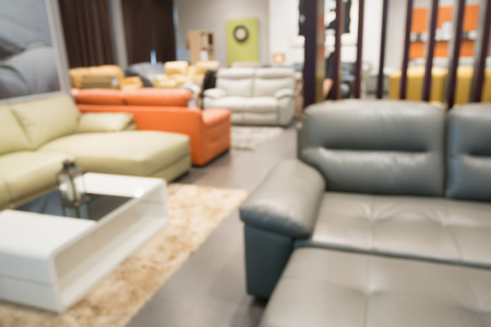 Abstract blur sofa in furniture store shop interior with bokeh light background for montage product displayの写真素材