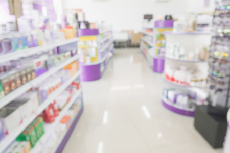 pharmacy drugstore shop interior with medicines vitamins supplement and over the counter healthcare product for healthy on shelves blur backgroundの写真素材