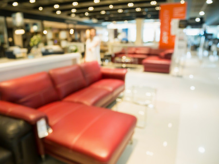 Abstract blur sofa in furniture store shop interior with bokeh light background for montage product displayの写真素材