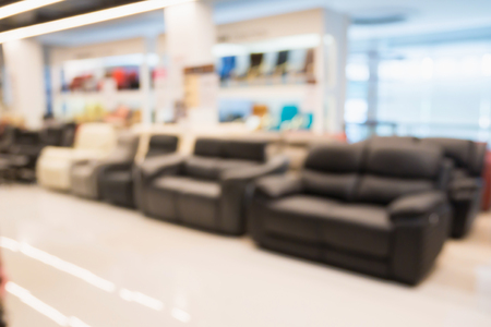 Abstract blur sofa in furniture store shop interior with bokeh light background for montage product displayの写真素材