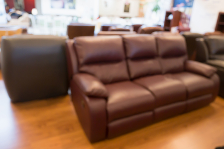 Abstract blur sofa in furniture store shop interior with bokeh light background for montage product displayの写真素材