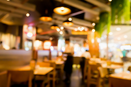 Restaurant cafe interior abstract blur background with bokeh lightの写真素材