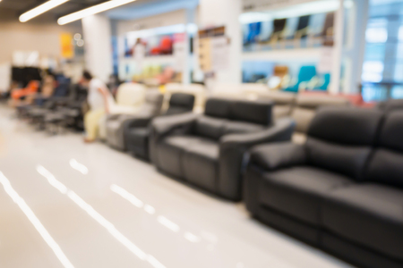 Abstract blur sofa in furniture store shop interior with bokeh light background for montage product displayの写真素材