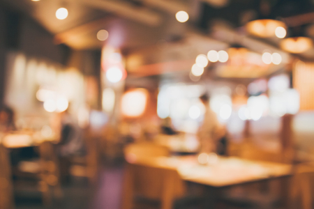 Restaurant cafe or coffee shop interior with people abstract defocused blur backgroundの写真素材