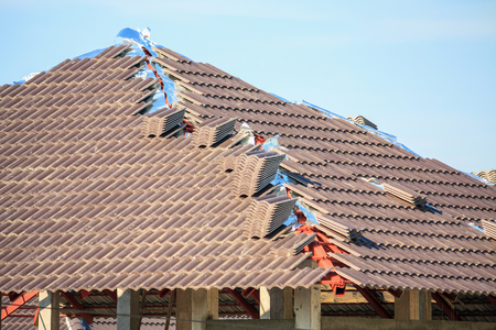 Roof house construction with lots of tile prepare to Installの写真素材