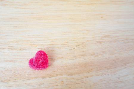 pink hearts candy on wood for valentines backgroundの写真素材