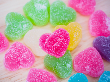 colorful hearts candy on wood for valentines backgroundの写真素材