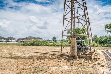 pile driver at house building construction siteの写真素材