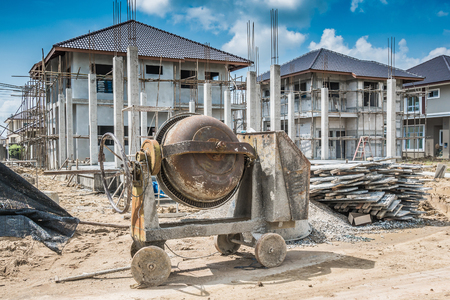 cement concrete mixer machine at new house building construction siteの写真素材