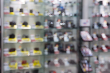 digital cameras and lenses in store shelf blur backgroundの写真素材