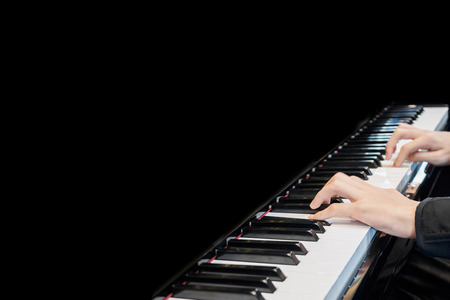 Close up musician hand playing pianoの写真素材
