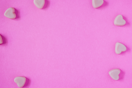 valentine candy hearts shape on pink backgroundの写真素材