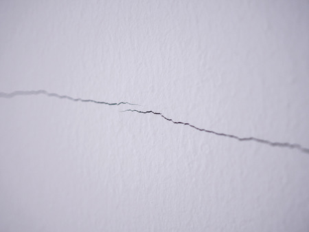 cracked on wall background close upの写真素材