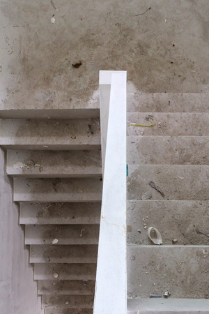 New house construction interior with concrete staircase at building siteの写真素材